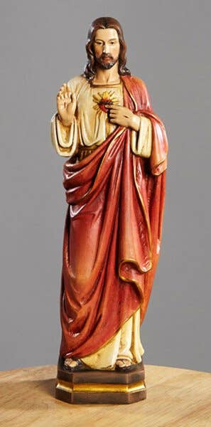 Jesus in red and white robes with sacred heart