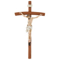 Wooden crucifix with a figure on a white background