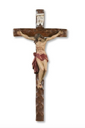 Wooden crucifix with flesh colored Jesus and red clothing