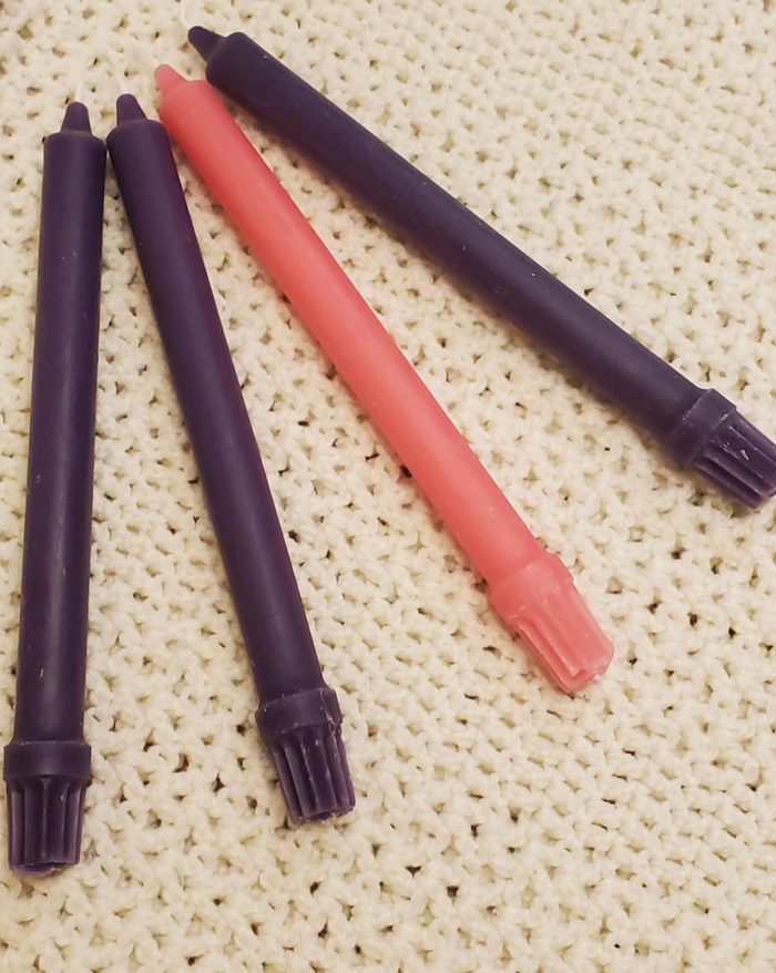 Advent candles with knitted white background