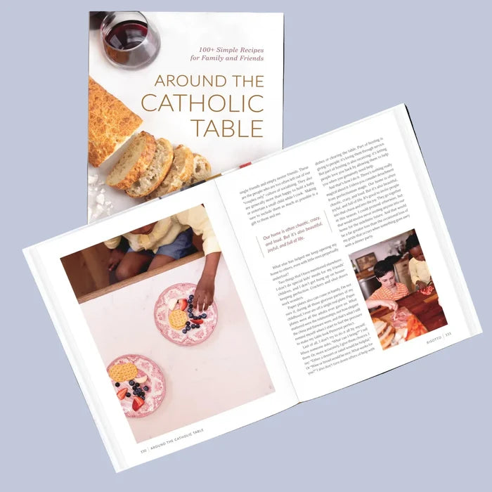 Book open to a page about 'Around the Catholic Table' with images of people and food.