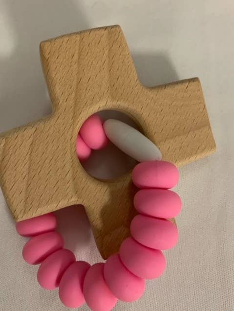 Wooden cross teether with silicone pink beads