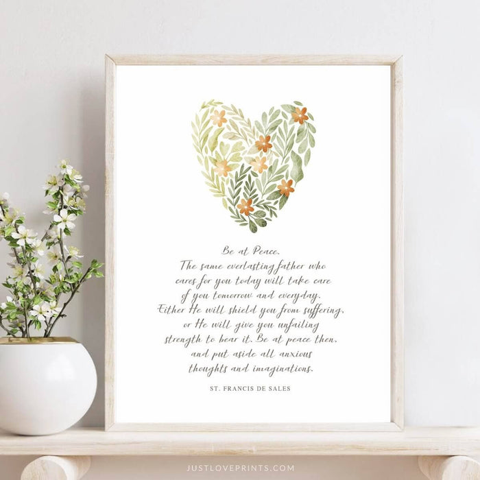 Plant design heart with white background nd text framed with light wood on table with plant