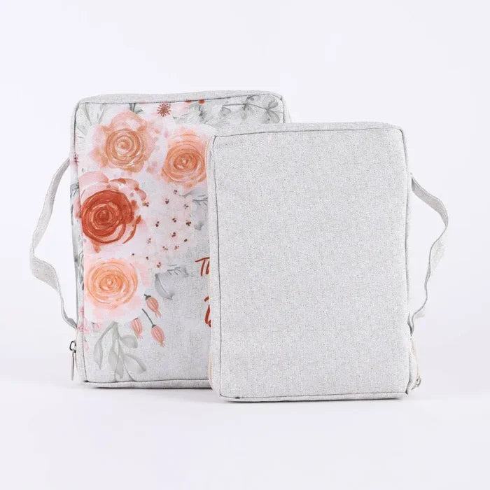 Floral-patterned Bible cover and plain gray Bible cover on a white background
