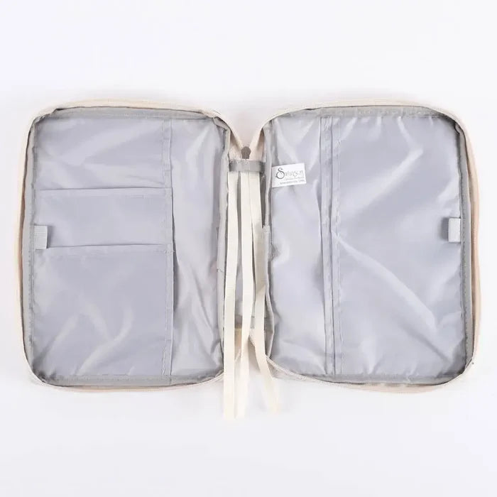 Open Bible cover organizer with compartments on a white background