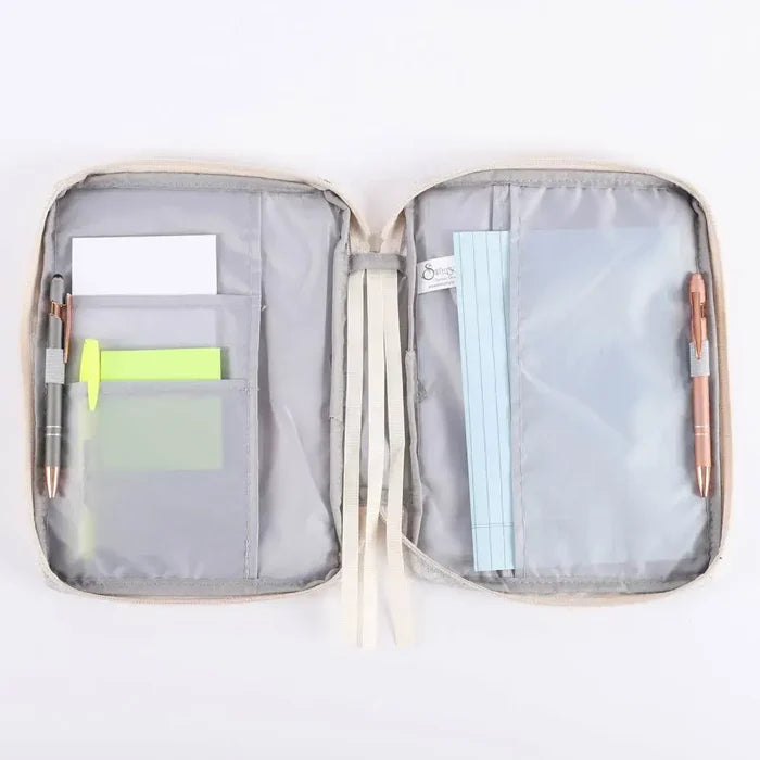 Open Bible cover organizer with compartments for notes, pens,  on a white background