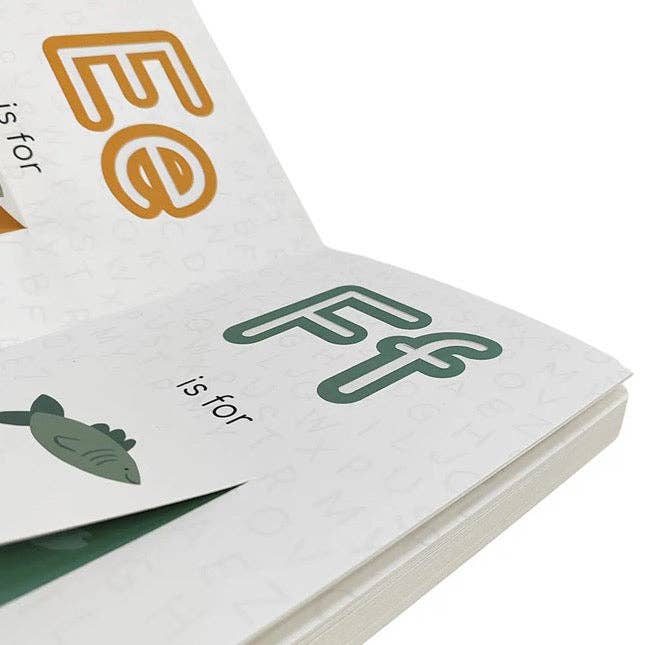 Open book showing pages with letters 'E' and 'F' printed on them.