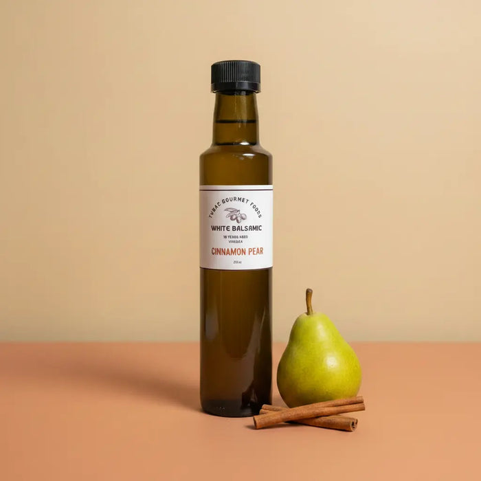 Cinnamon Pear White Balsamic Vinegar 250ml bottle on warm terracotta surface
