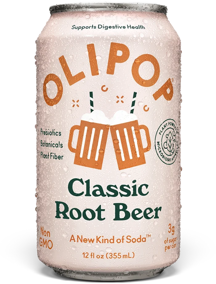 Aluminum can of OLIPOP Classic Root Beer, 12 fl oz, with condensation and orange beer mug graphics on pale pink label.