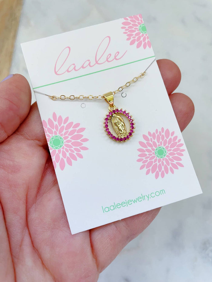 Gold necklace with a pink  pendant on a Laalee jewelry card.