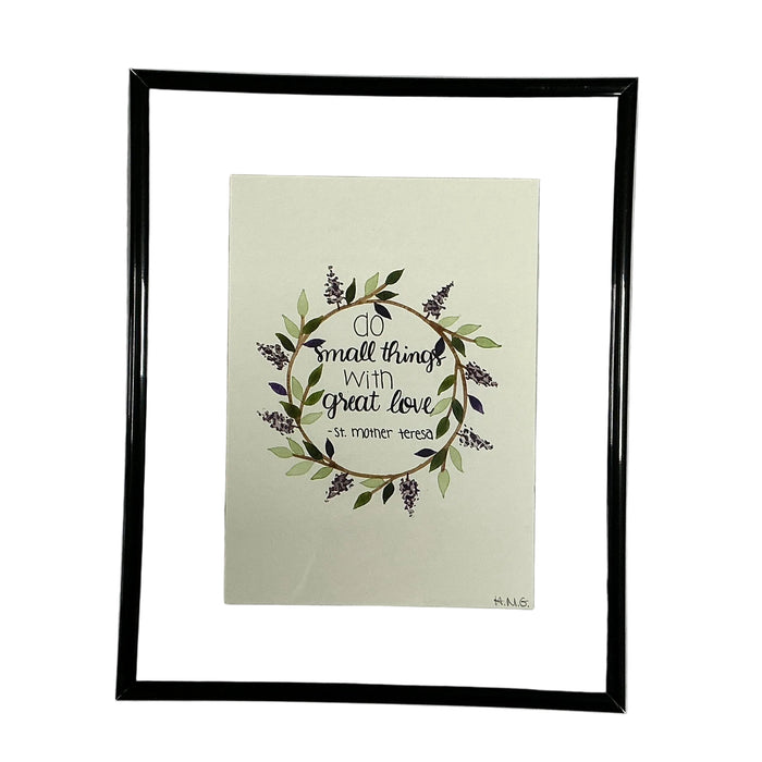 Framed artwork with decorative text and floral design on a light background