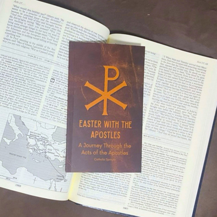 Book titled 'Easter with the Apostles' on an open book with a map.
