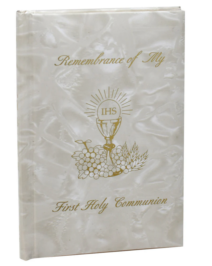 White book with first communion and gold design