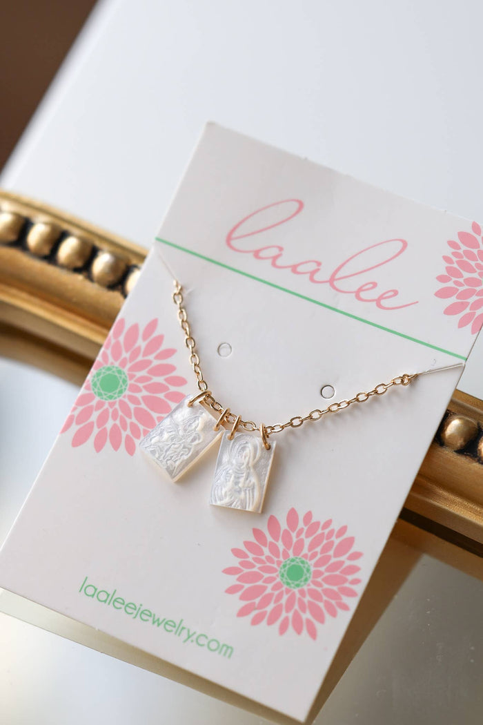 Scapular on a 'Laalee' branded card with floral design