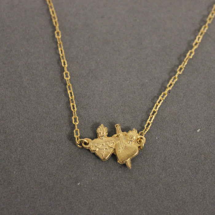 Gold necklace of divine heart with sword