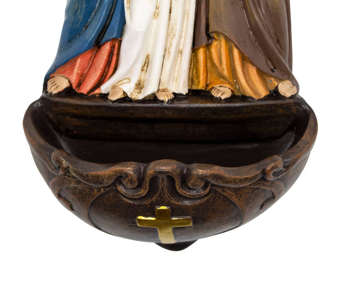 Decorative object with a religious figure and cross on a white background