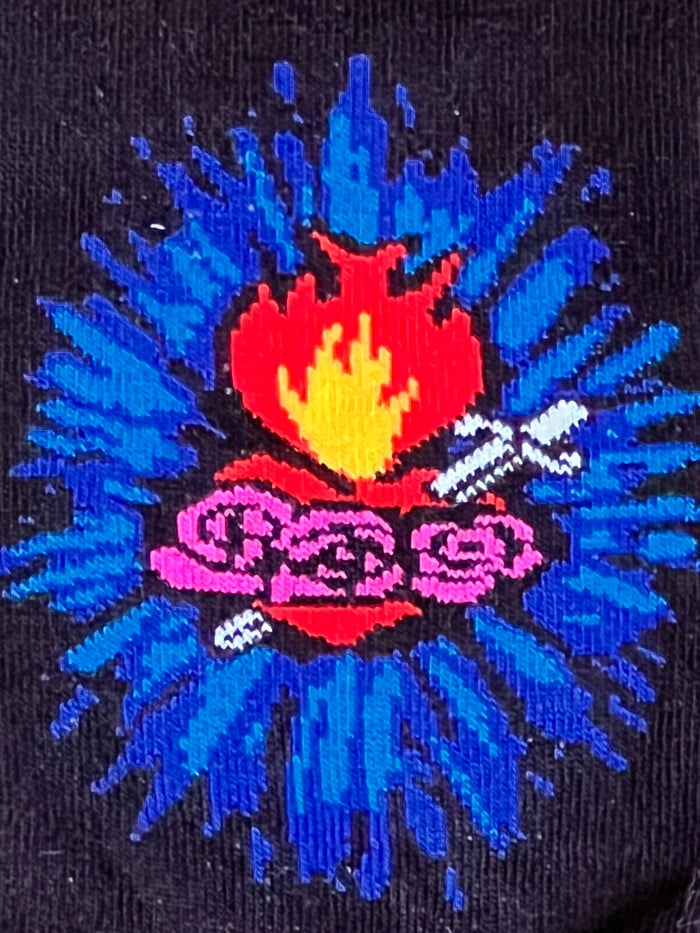 Colorful embroidered design on a black background