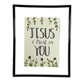 Framed print with 'Jesus I trust in You' text on a white shirt.