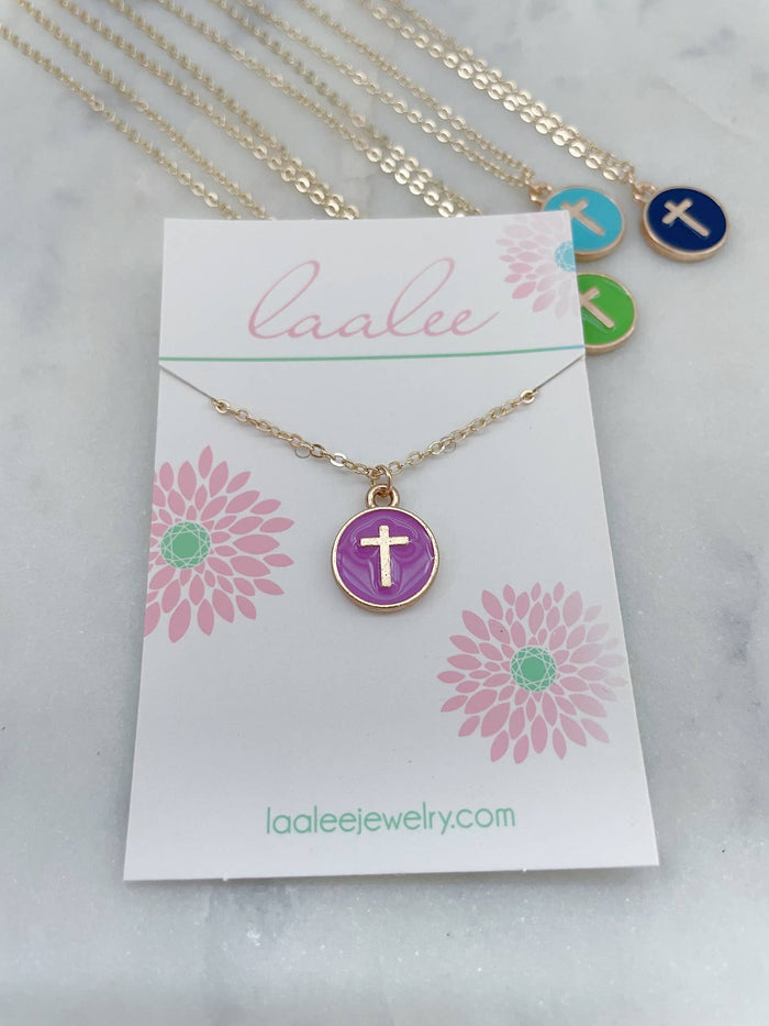 Necklace with a cross pendant on a 'Laalee' branded card with floral designs.