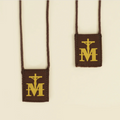 Scapulars with cross and 'M' symbol on a beige background