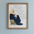 Framed artwork of a mother and child with text on a white surface.