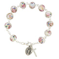 Silver bracelet with pink and colorful beads with miraculous medal and cross.