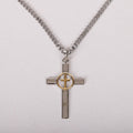 Cross-shaped pendant with gold center on a chain against a light gray background