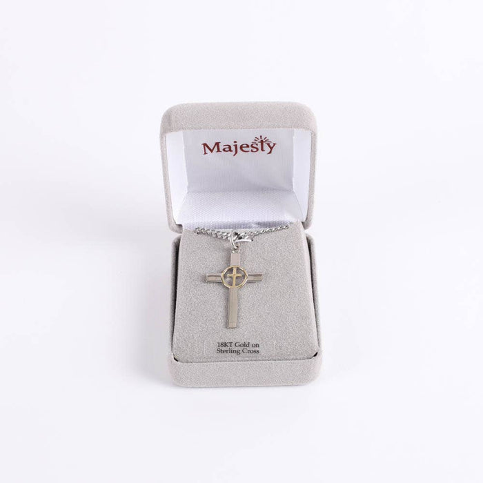 Silver cross necklace in a Majesty box on a white background