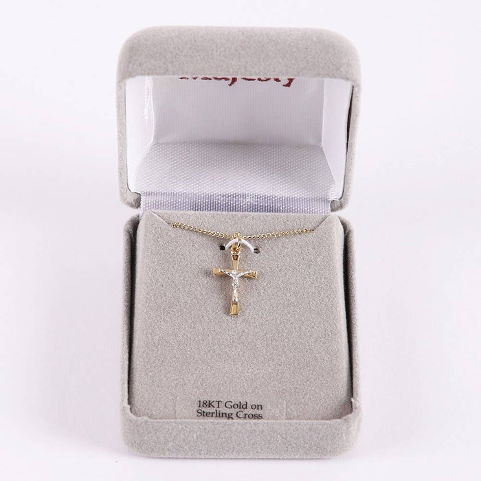 Gold crucifix necklace in a jewelry box with '18Kt Gold on Sterling Silver' text.