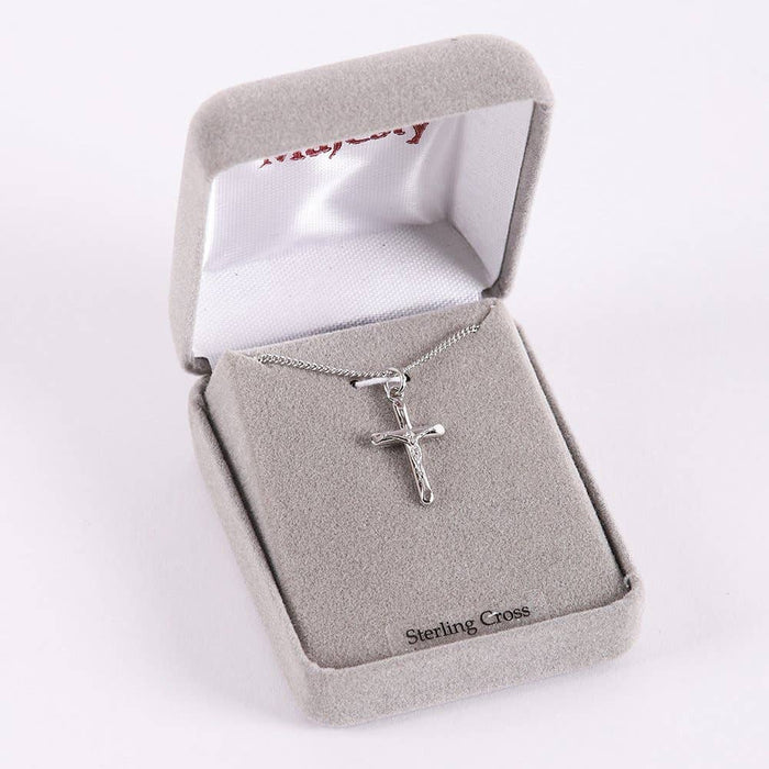 Silver cross necklace in a 'Sterling Cross' box on a white background