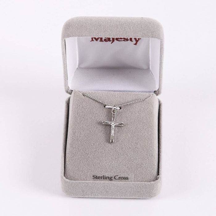 Silver cross necklace in a Majesty jewelry box on a white background