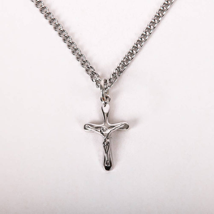 Silver crucifix necklace on a white background