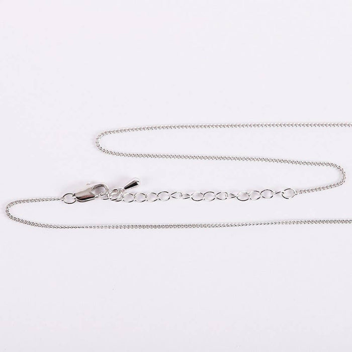 Silver chain necklace on a white background