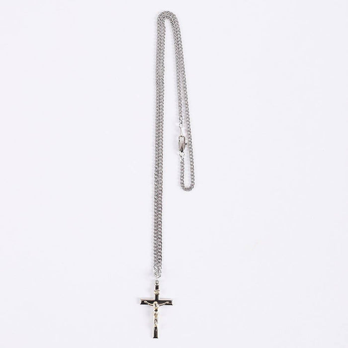 Silver chain necklace with a cross pendant on a white background