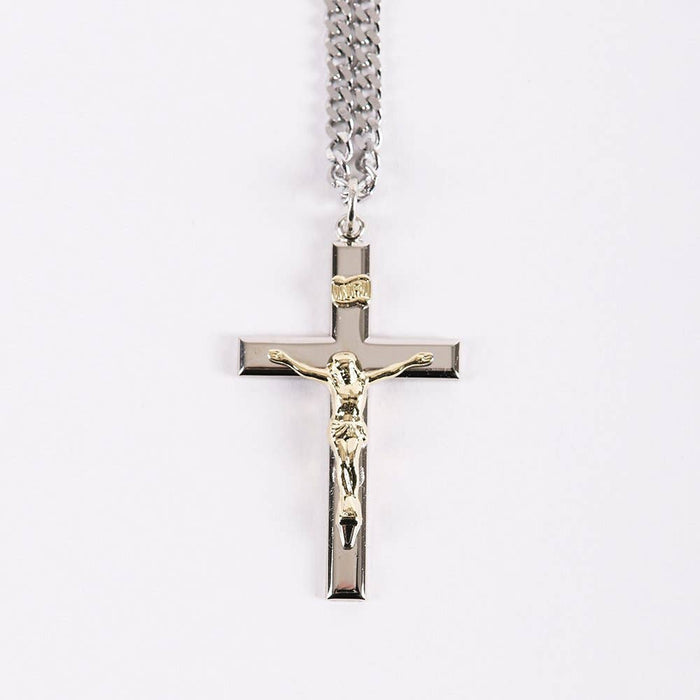 Silver crucifix pendant necklace on a white background