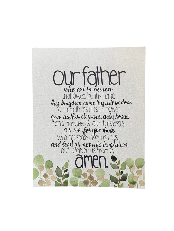 Plaque with the Lord's Prayer text and green leaf design on a white background