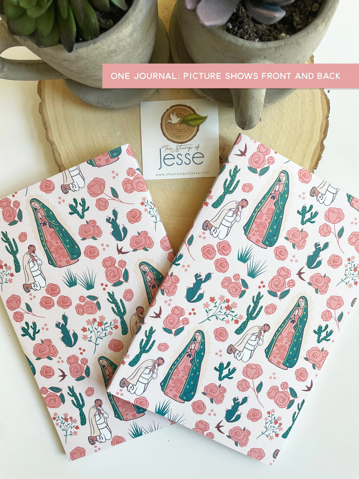 Two patterned journals with cactus and floral design on a wooden surface with plants.