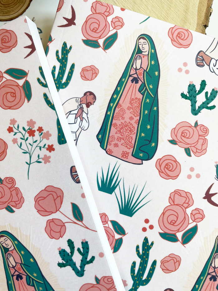 Notebook with illustrations of a woman in a green robe, cacti, and flowers on a white background.