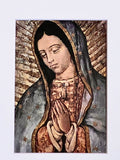 Religious icon of a woman with a dark headscarf and patterned garment on a light blue background