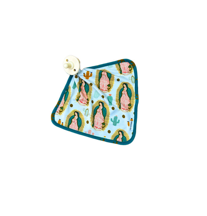 Baby blanket with a pattern of a religious figure on a white background