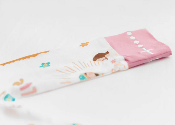Folded pjs with cartoon designs on a white background