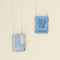 Scapular with religious design and text on a beige background