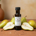 Pear White Balsamic Vinegar bottle with fresh pears on terracotta surface