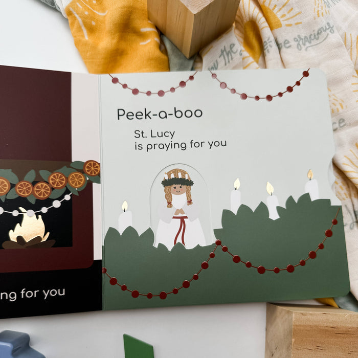 Children's book titled 'Peek-a-booo' with illustrations of a girl and candles on a white background.
