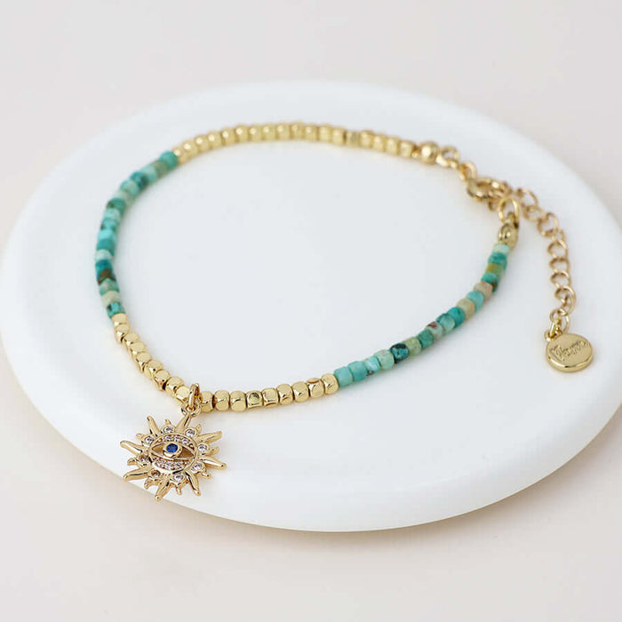 POM925 - Golden and turquoise bracelet with crystal sun charm