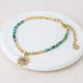 POM925 - Golden and turquoise bracelet with crystal sun charm