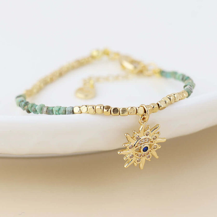 POM925 - Golden and turquoise bracelet with crystal sun charm