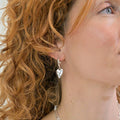 POM925 - Silver plated worn finish heart hoop earrings