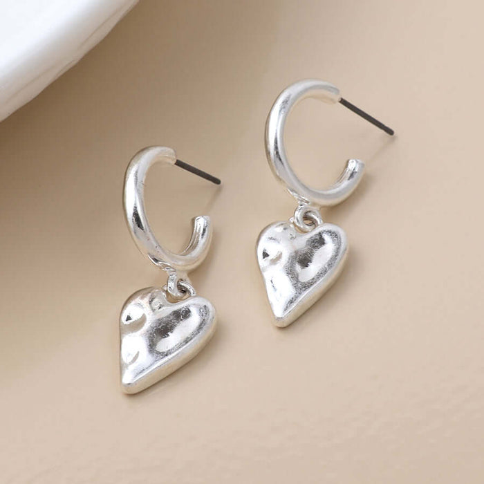 POM925 - Silver plated worn finish heart hoop earrings