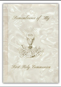 First Holy Communion book with chalice and grapes design on a textured beige background